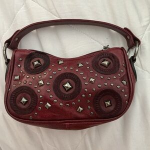 Berge Burgundy faux leather mini shoulder bag with studs and silver accents